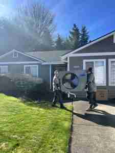 HVAC project Gallery - Techs carrying equipment Auburn