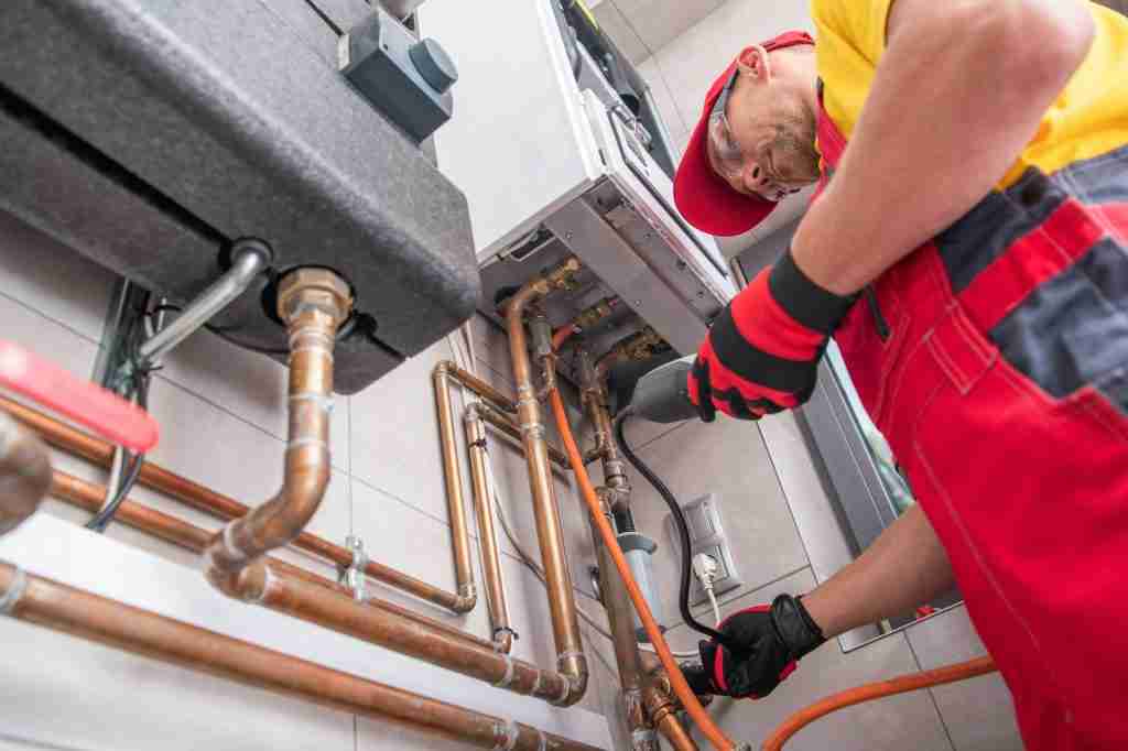 trusted residential heating and cooling company IN Puyallup | HVAC system Professional Gas Heating Technician with Gas Detector